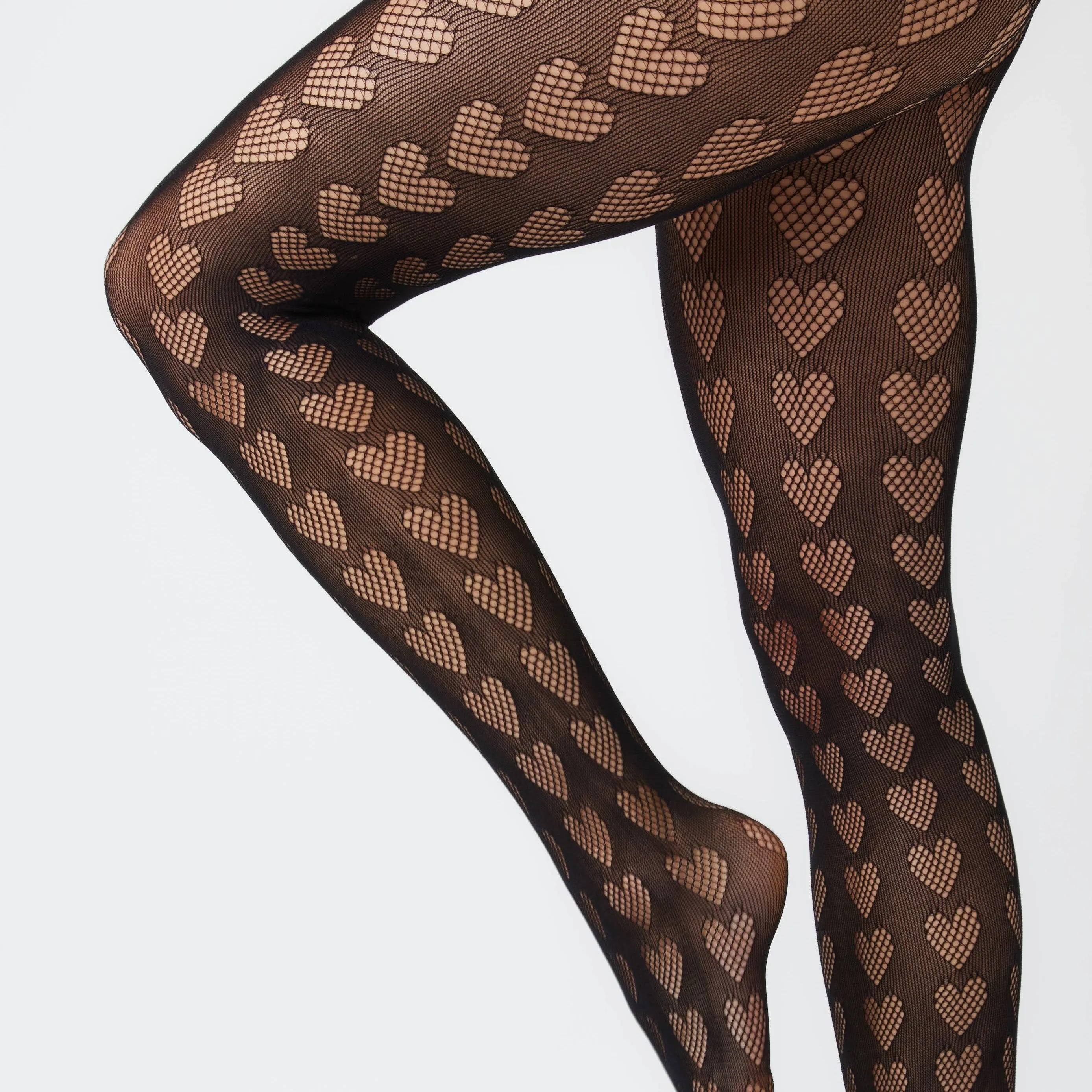 Heart Cut-Out Tights in Ebony - Fun and Fancy Legwear for Any Occasion!